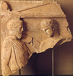 Fragment of a grave stele with a warrior and youth, about 400-375 BC. New York, Shelby White and Leon Levy collection